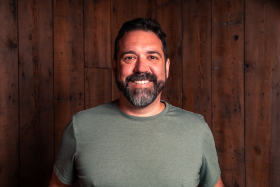 Headshot of State Line Distillery Founder, John Mleziva