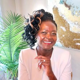 Mila Figg, author of 'The Little Elephant’s Big Adventure’, smiling at the camera.