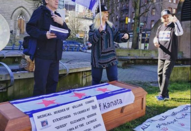 Kevin Annett (left) and other Republic of Kanata citizens gather in Vancouver  to remember William Combes, murdered eyewitness to crimes by Queen Elizabeth