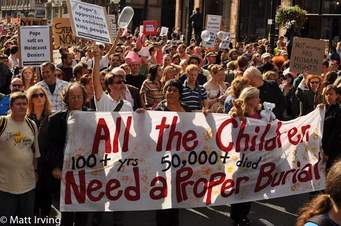 Kevin Annett (left, holding banner) and 20,000 friends demand Pope Benedict's arrest London England, April 2010